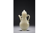 A CHINESE WHITE JADE TALL EWER WITH COVER