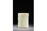 A CHINESE WHITE JADE 'MONK' BRUSHPOT