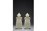 A PAIR OF CHINESE WHITE JADE VASES AND COVERS