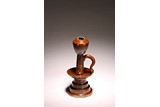 A CHINESE BROWN GLAZED OIL LAMP
