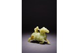 A YELLOW JADE 'BOY AND RAM' CARVING