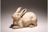A CHINESE PAINTED POTTERY FIGURE OF RABBIT 