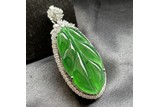 TYPE A CHINESE BRIGHT GREEN JADEITE 'LEAF' PENDANT