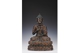 A PARCIL GILT BRONZE FIGURE OF SHAKYAMUNI 