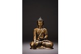A PARCEL GILT COPPER FIGURE OF SEATED SHAKYAMUNI 