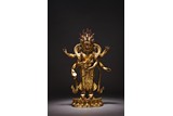 A GILT BRONZE FIGURE OF STANDING MAHAKALA