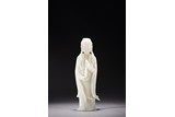 A CHINESE WHITE JADE CARVED FIGURE OF GUANYIN