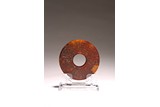 A CHINESE RUSSET BROWN JADE DISC BI