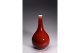 A CHINESE COPPER RED GLAZED BOTTLE VASE