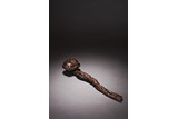 AN AGARWOOD CARVED 'PEACH AND BAMBOO' RUYI SCEPTER