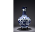 A CHINESE BLUE AND WHITE 'FLOWERS' BOTTLE VASE