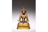 A GILT BRONZE FIGURE OF SEATED AMITAYUS
