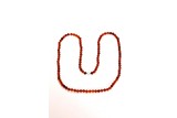 AN AMBER 108 BEAD BUDDHIST NECKLACE