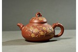 A YIXING 'PLUM BLOSSOM' TEAPOT