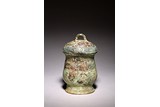 AN ARCHAIC BRONZE 'TAOTIE' WINE VESSEL AND COVER 