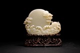 A CHINESE WHITE JADE CARVING OF 'RISING SUN' 