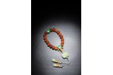 A CHINESE AMBER AND JADEITE ROSARY BRACELET