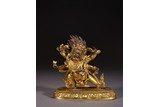 A GILT BRONZE FIGURE OF STANDING MAHAKALA