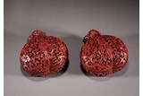 A PAIR OF CINNABAR LACQUER 'POMEGRANATES' BOXES