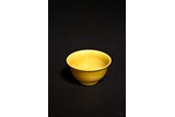 A SMALL YELLOW GLAZED WINE CUP