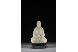 A WHITE JADE CARVED FIGURE OF SEATED AMITABHA