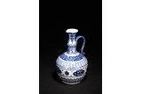 A CHINESE BLUE AND WHITE EWER WITH HANDLE
