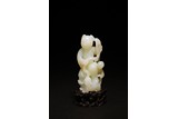A WHITE JADE 'BOYS' CARVING