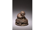 A CHINESE LIMESTONE CARVED 'LION' WEIGHT