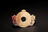 AN ARCHAIC JADE NOTCHED 'DRAGON' BI DISC