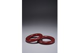A PAIR OF OPAQUE RED AGATE BRACELETS