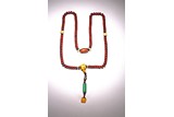 A CHINESE OR TIBETAN BUDDHIST RED PUTI BEAD NECKLACE