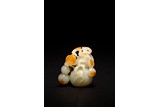 A WHITE JADE 'DOUBLE GOURDS' WITH RUSSET SKIN