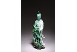 A LARGE JADEITE CARVED FIGURE OF STANDING GUANYIN