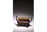 A CHINESE PATINATED BRONZE CENSER 