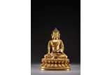 A GILT BRONZE STATUE OF SHAKYAMUNI