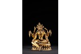 A GILT BRONZE STATUE OF VASUDHARA