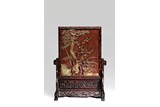 A CARVED QIYANG 'FLOWERS' TABLE SCREEN 
