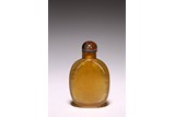 AN AGATE CARVED SNUFF BOTTLE