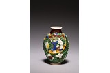 A FAMILLE ROSE MOULDED FIGURES SNUFF BOTTLE