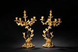 A PAIR OF LARGE EUROPEAN GILT CANDLESTICKS 