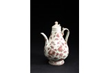 AN UNDERGLAZED 'FLOWERS' RED TEAPOT