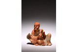 A CHINESE SOAPSTONE FIGURE OF LUOHAN AND TIGER CUB