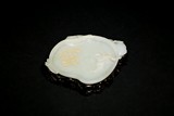 A WHITE JADE INSCRIBED 'PEACH' WASHER