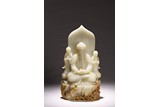 A WHITE JADE CARVED BUDDHA AND ATTENDANTS