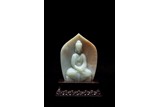 A CHINESE CELADON JADE CARVED AMITABHA