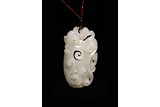 A CHINESE WHITE JADE 'CHILONG' PENDANT