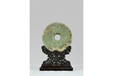 LARGE ARCHAIC CELADON JADE DISC WITH HARDWOOD STAND