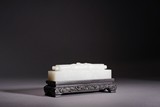 A CHINESE WHITE JADE 'HANDSCROLL' PAPERWEIGHT
