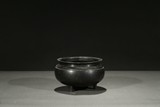 A CHINESE BRONZE TRIPOD CENSER