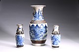 A GROUP OF THREE BLUE AND WHITE CARVED VASES 